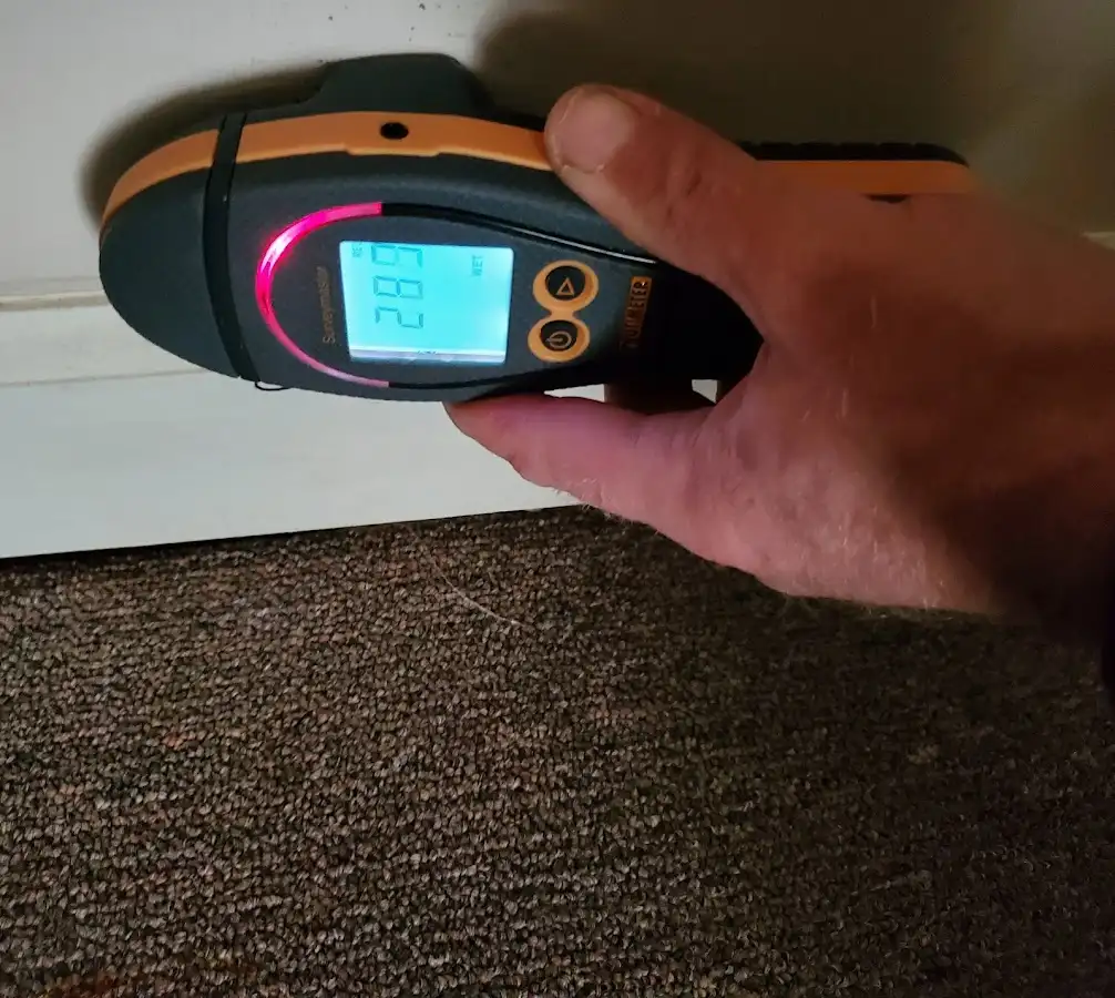 Moisture detection at baseboard during Burst Pipe Cleanup in East Kapolei